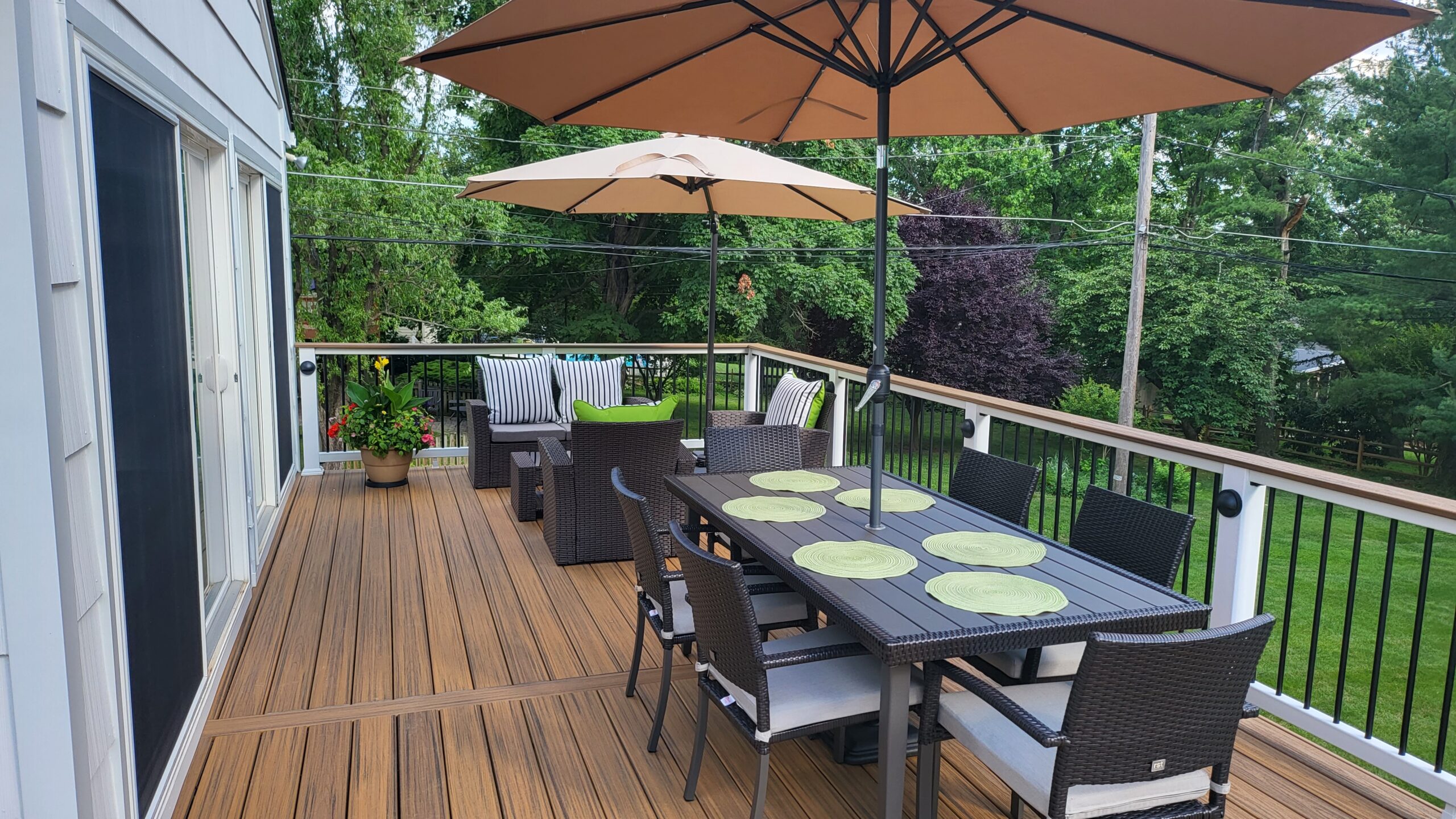 Outdoor deck with dining and seating areas